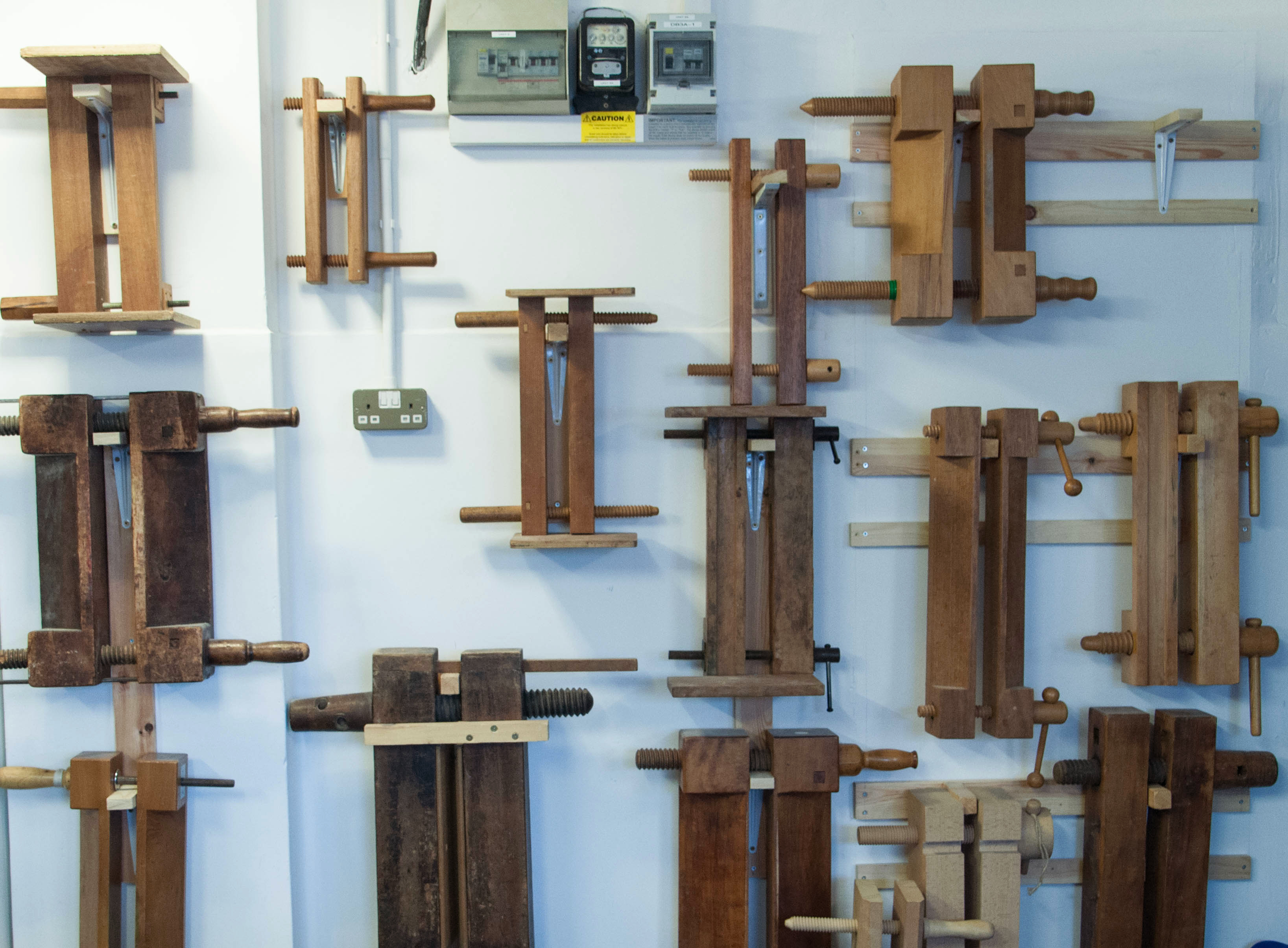 Finishing presses hanging on a wall